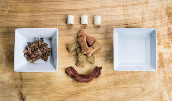 Dog food over a wooden board served very chic way.