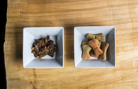 Dog food over a wooden board served very chic way.