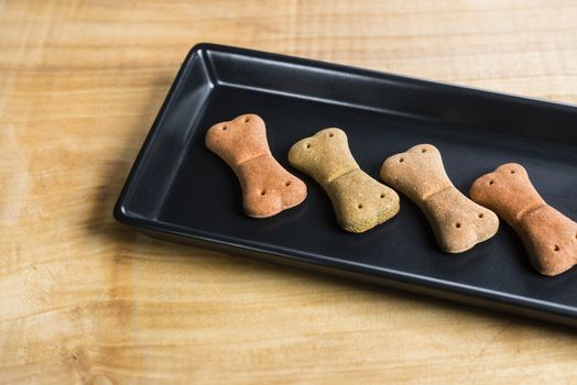 Dog food over a wooden board served very chic way.