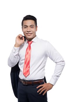 Portrait of confident asian businessman standing over white.