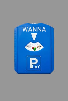 A german parking disc with the words Wanna and Play, isolated on grey