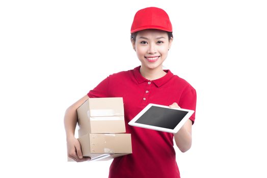 Delivery woman with a box and a tablet in hands