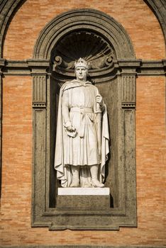 Statue of king Charles I in a niche of the wall of the Royal Palace of Naples, Italy