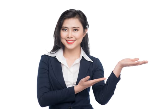 Portrait of an attractive young businesswoman showing by hands isolated on white.