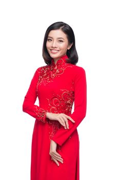 Charming Vietnamese Woman in Ao Dai Traditional Dress isolated on white.