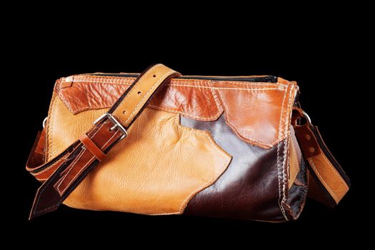 Leather bag on a black background.