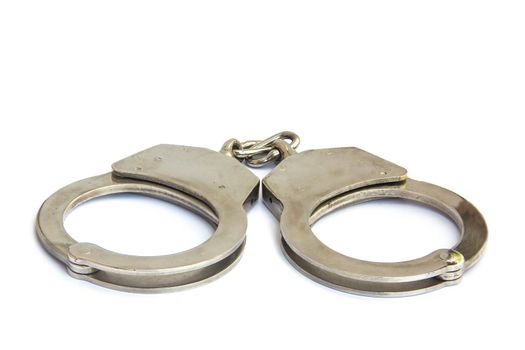 shackle,Handcuffs. Steel handcuffs isolated in white background