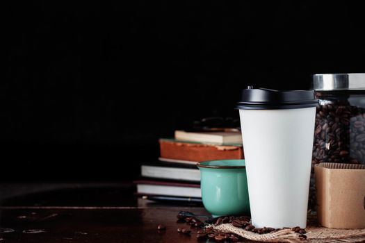 Cup of coffee and equipment on the desk.