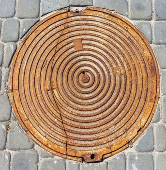 metal manhole cover close-up on the street