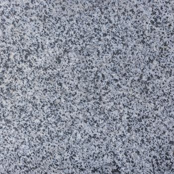 Abstract background texture of natural granite close-up