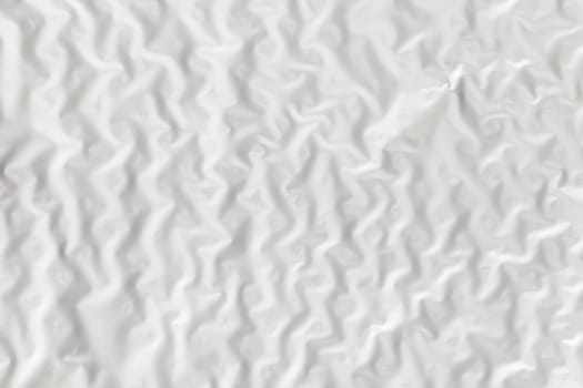 Abstract background texture of white wrinkled paper close-up
