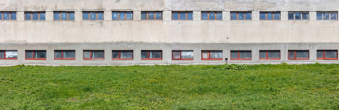 Abstract background, concrete building and grass