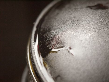 very up close perspiration on top of coffee pot strainer black and metal and glass