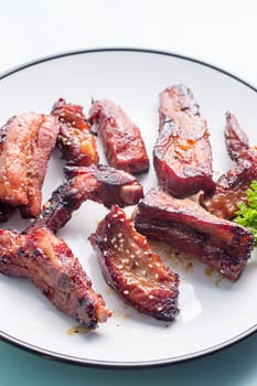 German style pork ribs on white plate