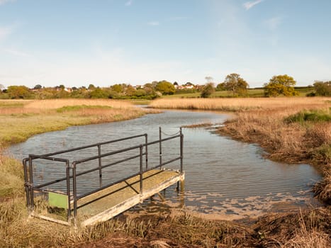 a sluice outside in the country with river lake