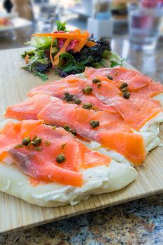 Cold Smoked Salmon with Capers and Cream Cheese on Flat Bread with Salad