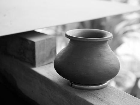 BLACK AND WHITE PHOTO OF WATER POT MADE OF CERAMIC
