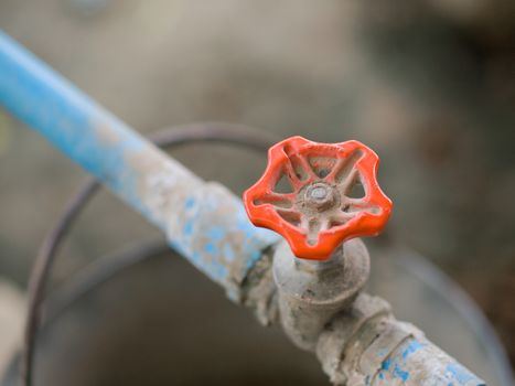 COLOR PHOTO OF CLOSE-UP SHOT OF METAL TAP