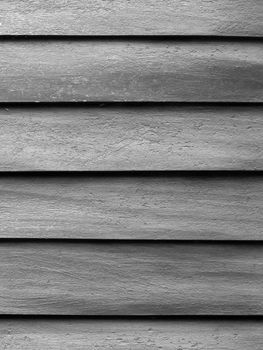 BLACK AND WHITE PHOTO OF THE ROUGH TEXTURE OF WOOD