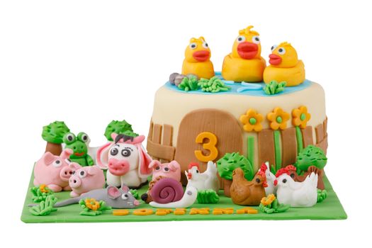 birthday cake with farm marzipan animals and number 3 isolated on white background