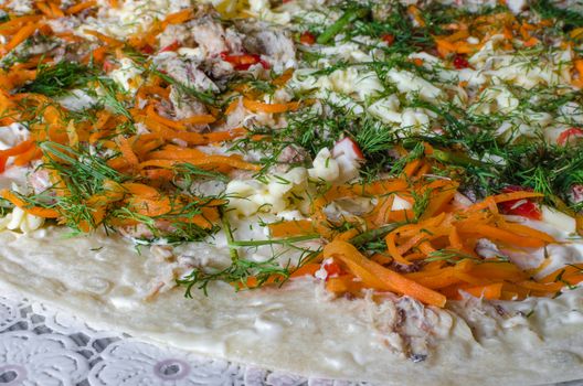 The pizza is ready for cooking, closeup