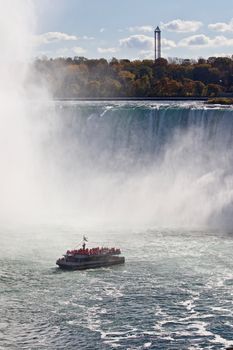 Beautiful background with amazing Niagara waterfall and a ship