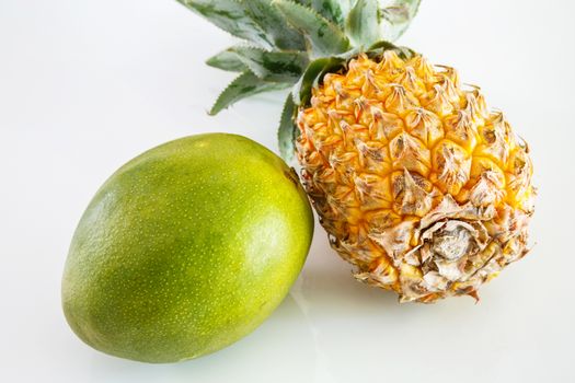 ananas, mango on white background