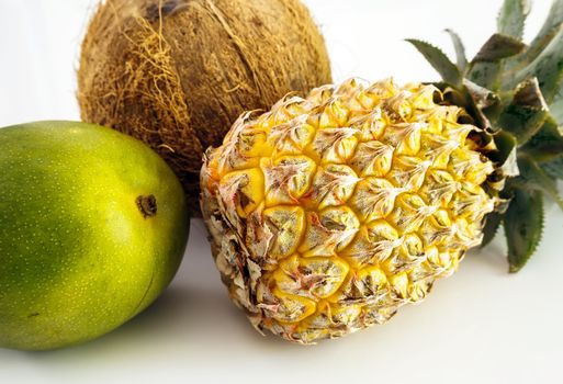 coconut, ananas, mango on white background