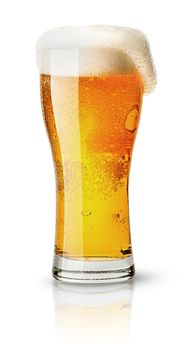 Light beer in sweaty glass and foam isolated on white background