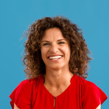 Portrait of a beautiful woman over a blue background