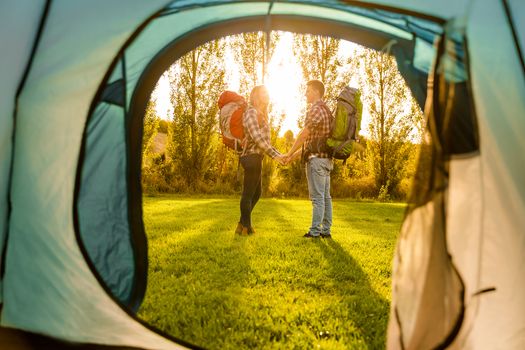 Shot of a happy couple camping on the nature