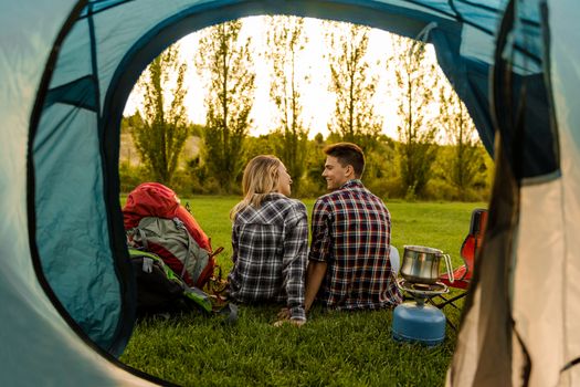 Shot of a happy couple camping on the nature