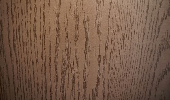 Close-up of wavy wood texture. Brown color.