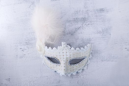 White carnival mask. Symbols of Jewish holiday Purim