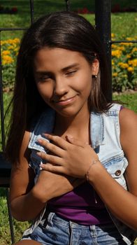 Teen Girl Hands Over Heart