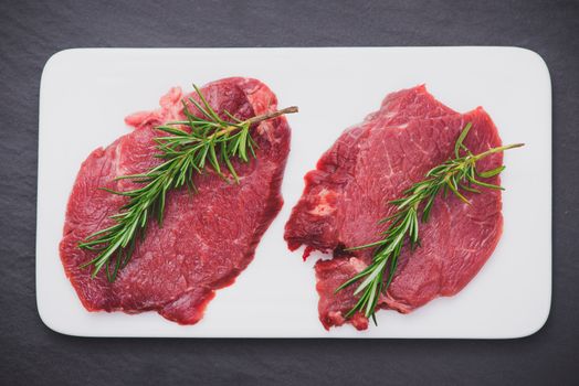 Raw beef meat sliced on a plate