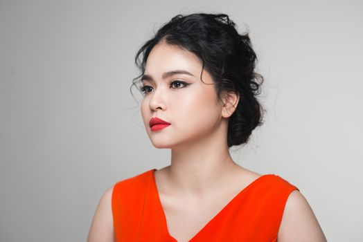 Fashion portrait of asian woman with elegant hairstyle. Perfect makeup.