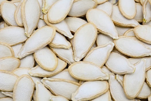 Closeup of dried pumpkin seeds for food background