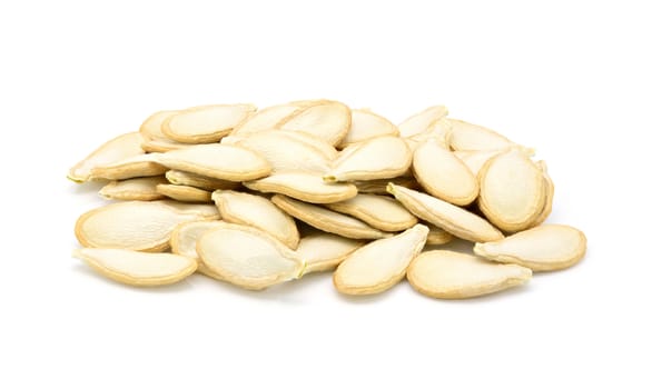 Group of dried pumpkin seeds on a white background