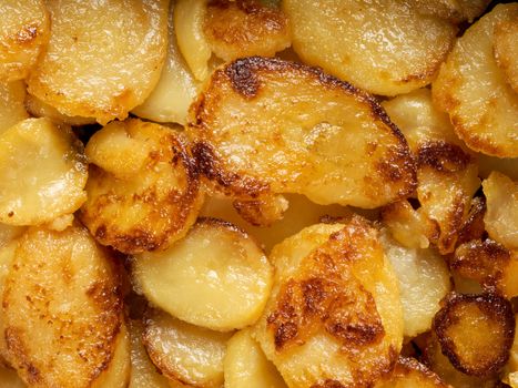 close up of rustic golden german pan fried potato bratkartofflen food background