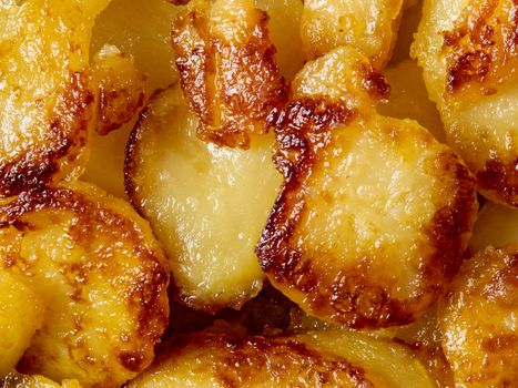 close up of rustic golden german pan fried potato bratkartofflen food background
