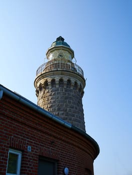 Old stone traditional lighthouse on the beach the island of Aeroe Denmark