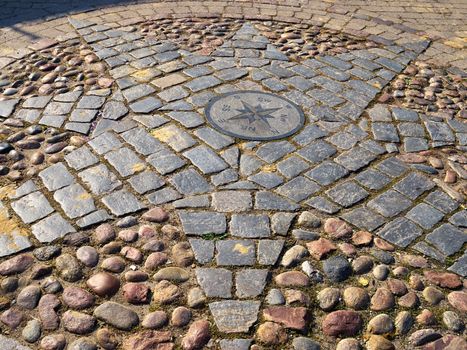 Beautiful compass directions wind rose made from stone  