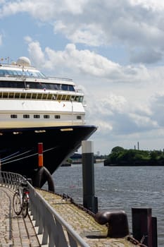 view to the front part of cruise liner moored in the seaport. Closeup.