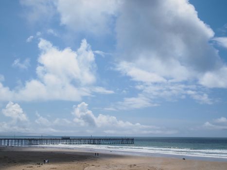 Image of wooden jetty with ocean and sky in background