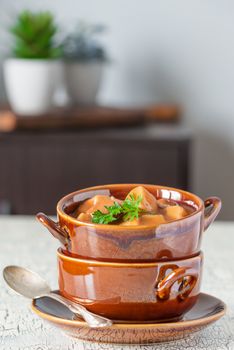 Bowl of hot and homemade steak and potato soup.