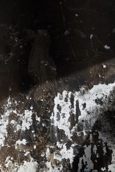 Old burned wall. Vertical close-up photo