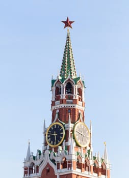 Spasskaya Tower of Moscow Kremlin on Red Square in Victory Day in Moscow, Russia on the blue sky background