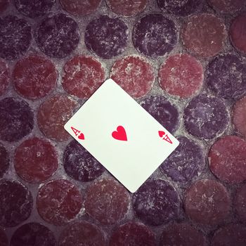 Ace of hearts card on the floor. Good luck concept.