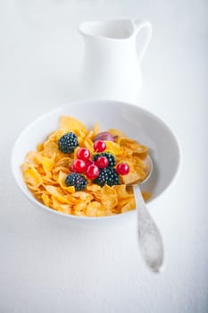 A fresh bowl of corn flakes in a white plate